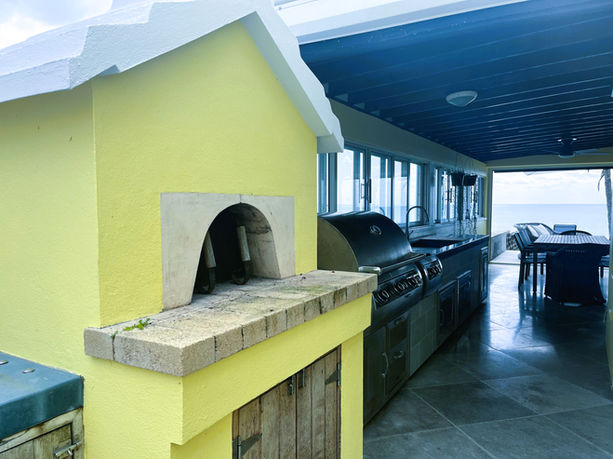 The outdoor kitchen and dining area at SeaView Luxury Vacation Rental. 