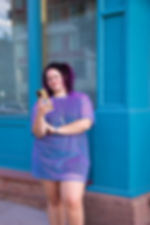 Kailee Nauman of Eclectic Designs .CO looking at her phone