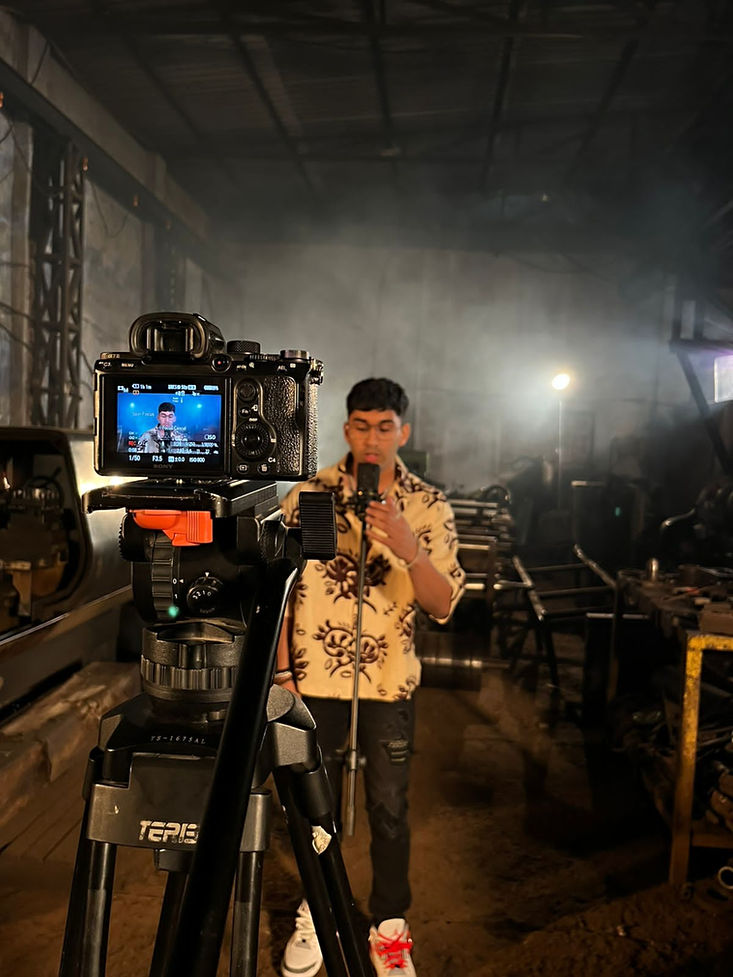 BTS picture from a music video of an independent artist, setup in an industry.