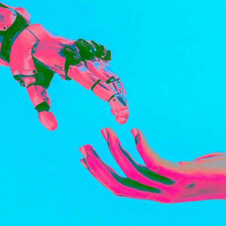 A robot and a human about to touch hands