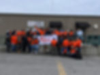 group of Home Depot volunteers in front of the building