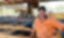 Worker in sawmill smiling at camera