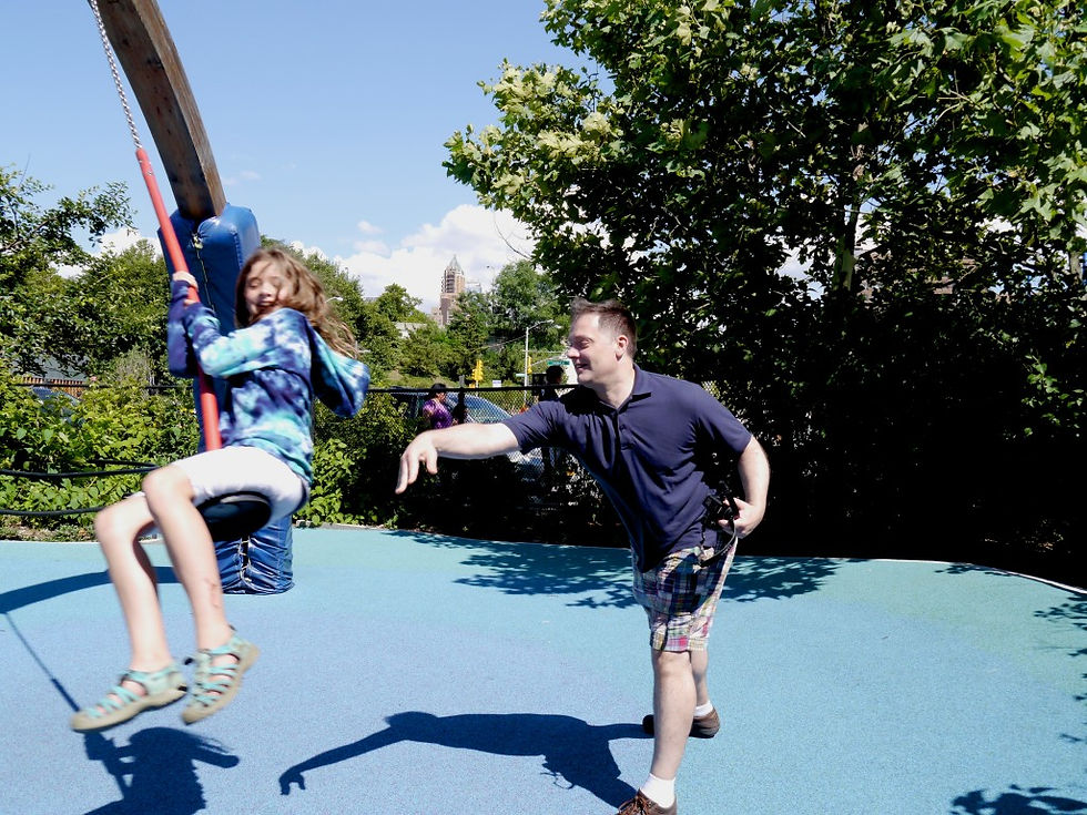 Maddie and James in Brooklyn Bridge Park in Swing Valley