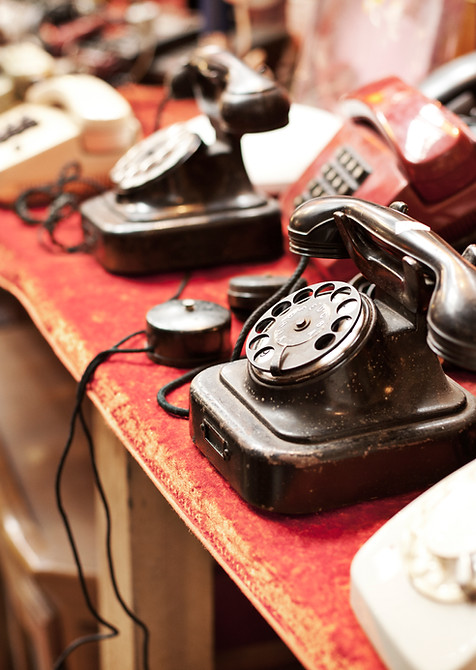 Old telephones in a row