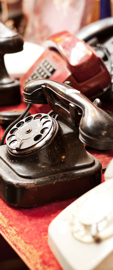 Old telephones in a row