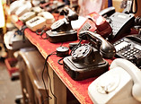 Old telephones in a row