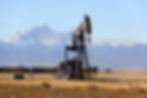 Oil and gas exploration site with pumpjack using seismoelectric detection technology for subsurface mapping