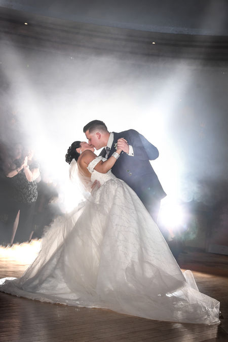 Wedding photographer in St. Catharines captures the first dance of a bride and groom at Club Roma.