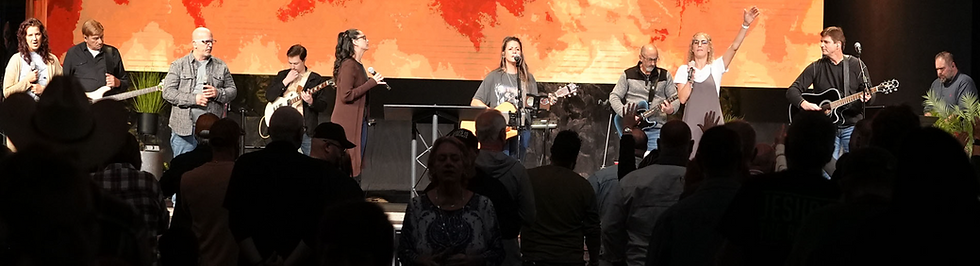 Band performing on stage for an audience