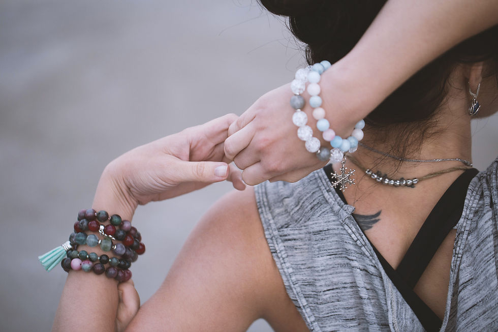 sacred bracelets on woman's wrist preparing for akashic records readings