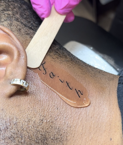 Neck tattoo of a word