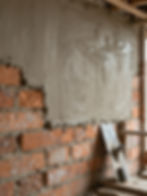 Brick wall with wet rendering and trowel for malwa rendering services
