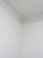 Smooth white wall and ceiling corner