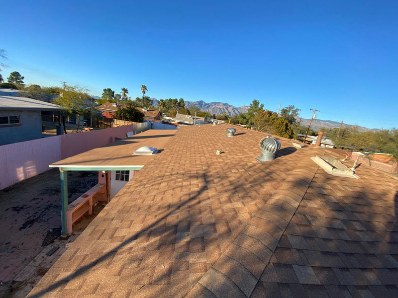 New shingle roof with the Catalina Mountains behind it