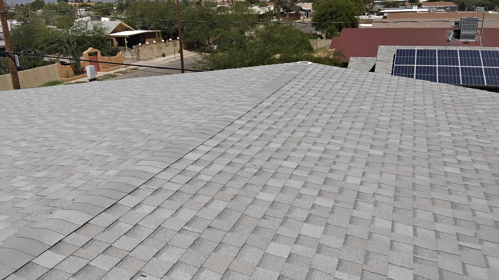 Newly replaced asphalt shingle roof on a Tucson home by Canyon Roofing