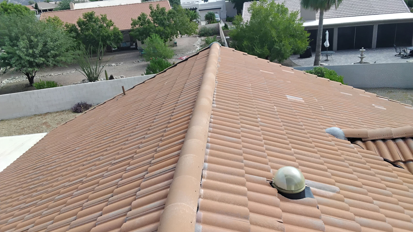 Tile roof ridge repaired by Canyon Roofing on a home in the Tucson foothills