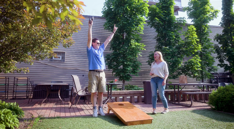 happy patrons playing bags at jimmys north star