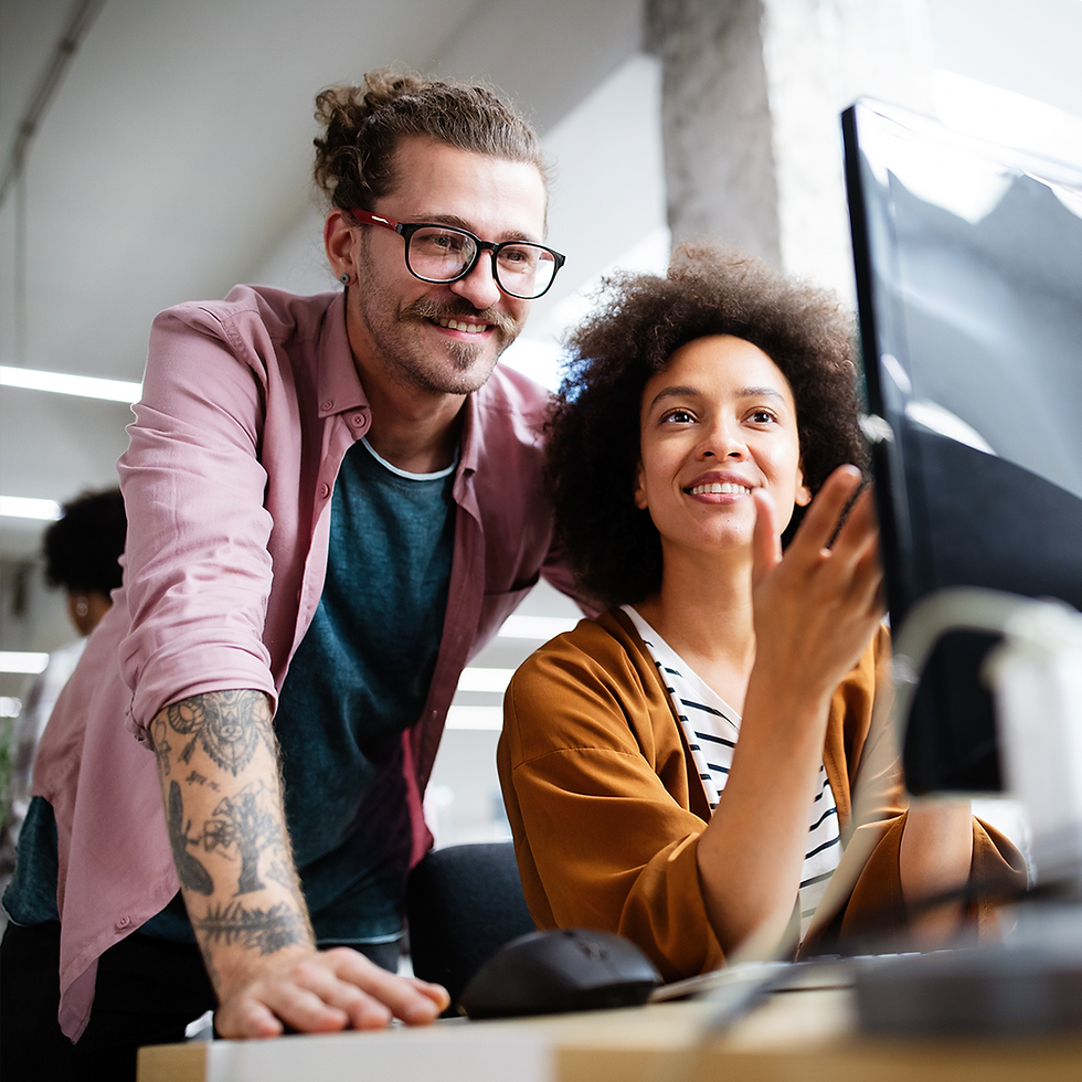 two women using laptop