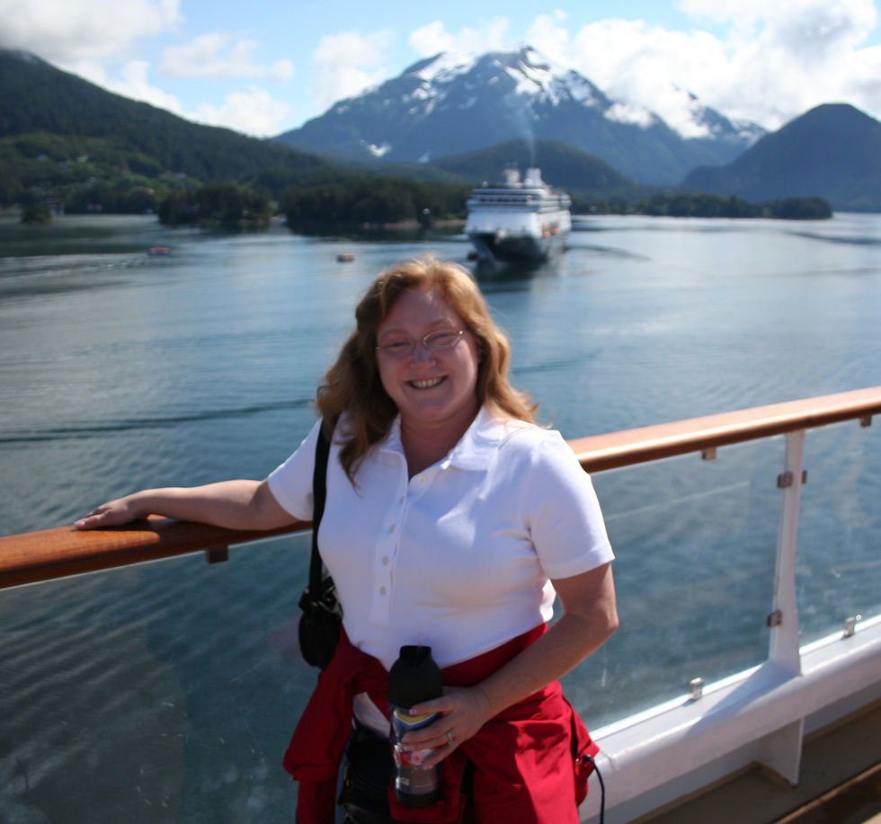 Janette on Deck in Alaska after day ashore, started out rain jacket weather, ending up 75 and sunny!