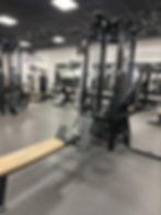 To use a low row machine, sit down, grab the handles, and pull them towards your body, working your back muscles.