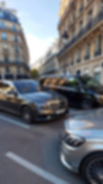 L'atelier_digital_Two_sedans_and_a_premium_van_parked_in_a_car_park_on_the_Champs-É_5cfb0e