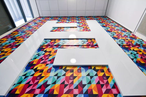 A professionally installed wall wrap and sign displaying vibrant graphics and clear messaging, enhancing the visual appeal and communication of the indoor or outdoor space.