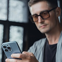 Pretty Young Handsome Man Using Laptop in cafe, outdoor portrait business man, hipster sty