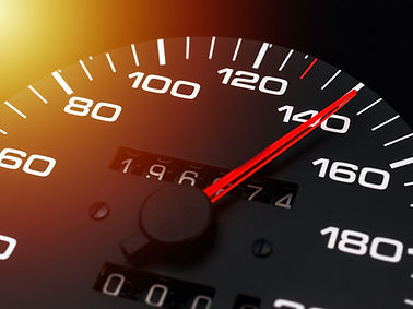 Car speedometer. Auto car speedometer shows 140 km h or miles.Closeup shot,dark black back