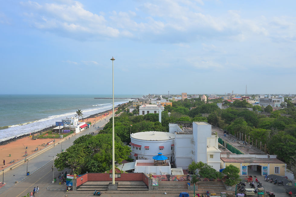 Elevated view of Pondicherry Promenade, White Town rooftops, Goubert Avenue and the Bay of Bengal from above.