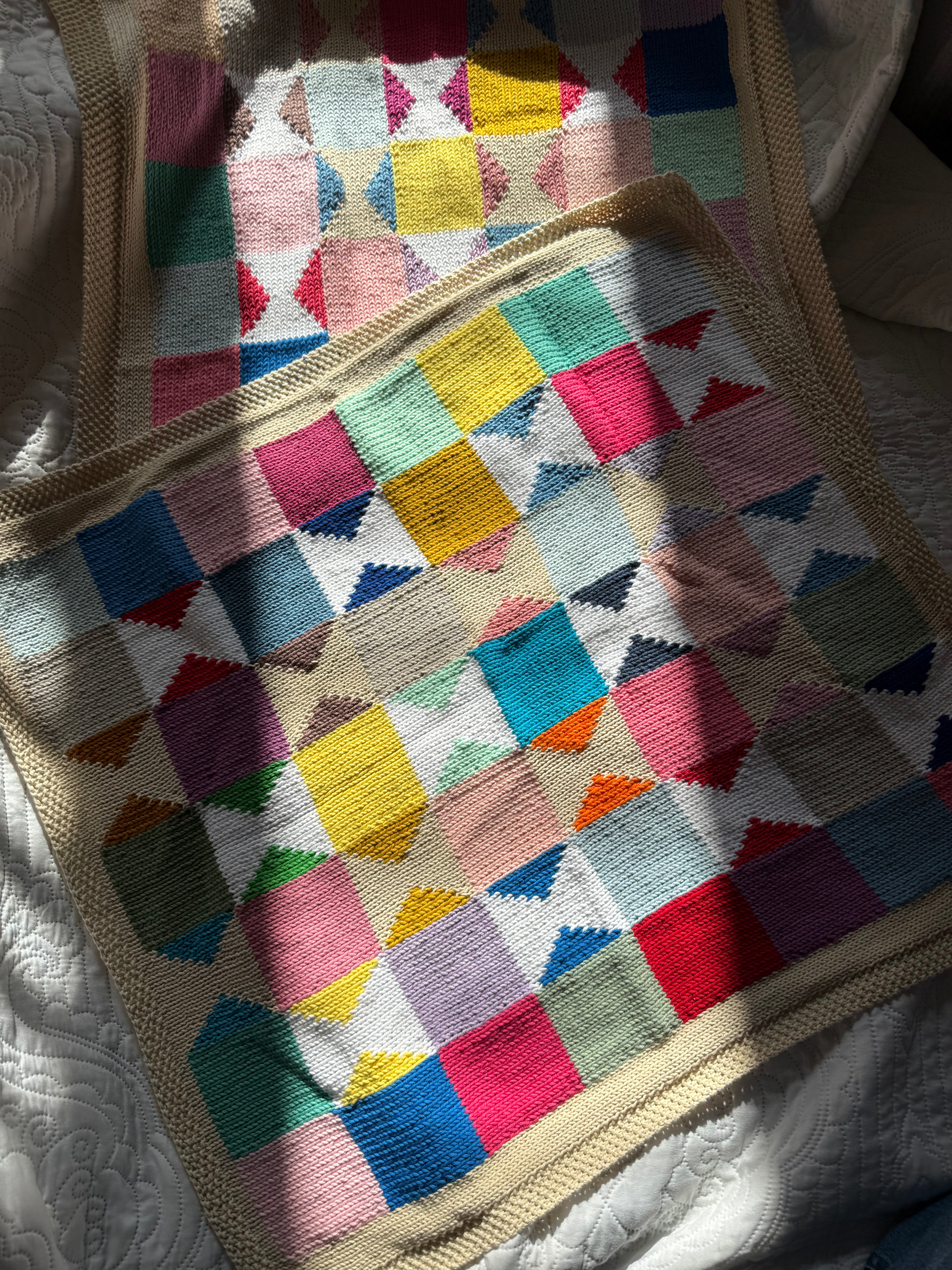 Hand knitted patchwork blanket