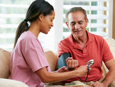 a functional medicine nurse with a patient