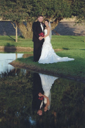 bride and groom reflection on water