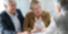 Elderly couple speaking with their lawyer