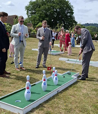 Male Guests at wedding playing mini golf3lq.jpg