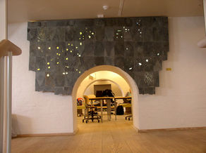 A public decoration from slate, copper and light.