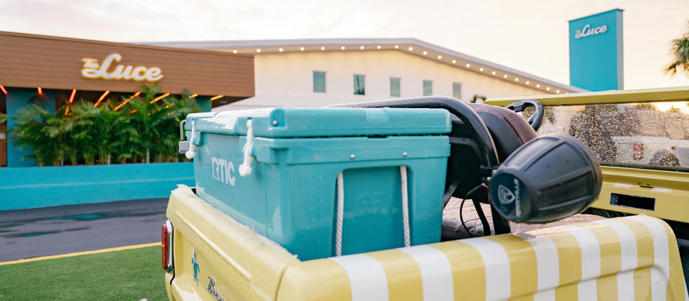 Vintage ford bronco and teal RTIC cooler outside of The Luce Hotel in St. Pete Beach