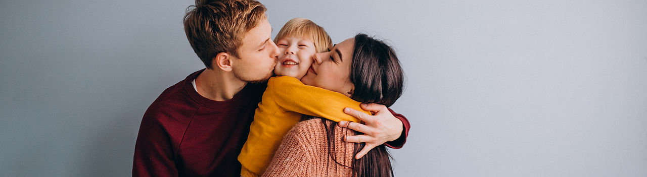 young-family-with-little-son-together-on-grey2.jpg
