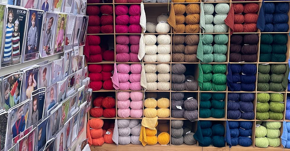 wall of yarn and pattern books