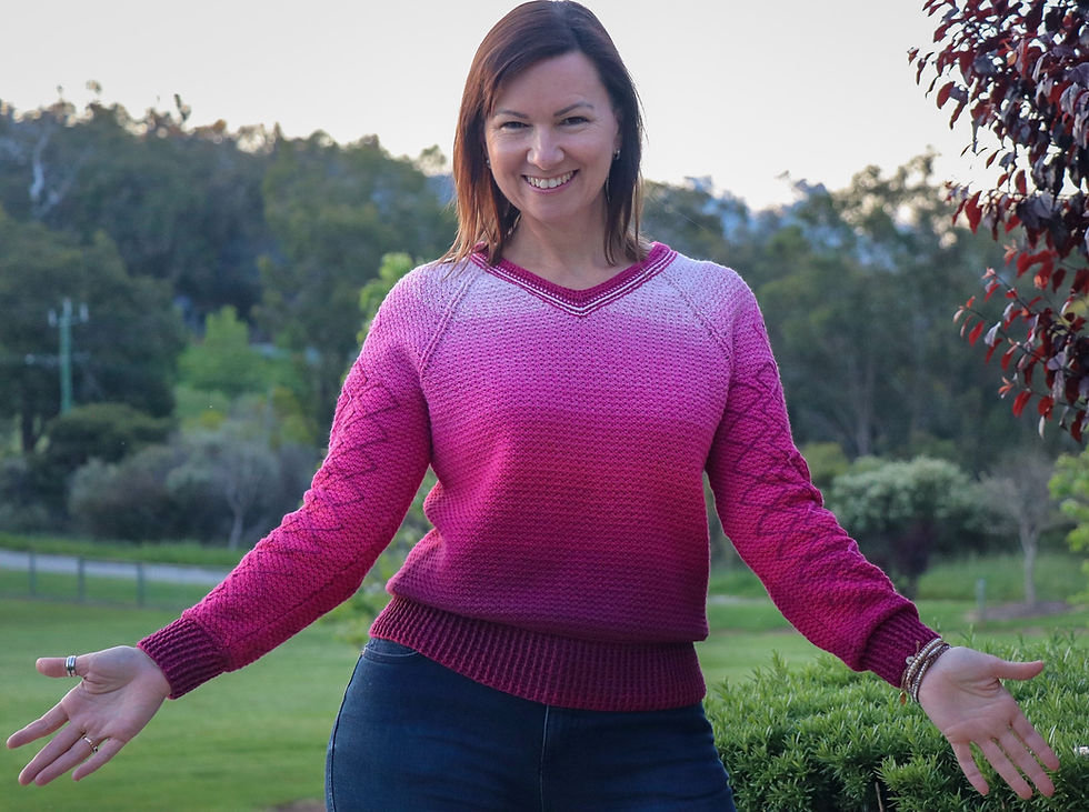 person wearing pink crocheted V-neck sweater