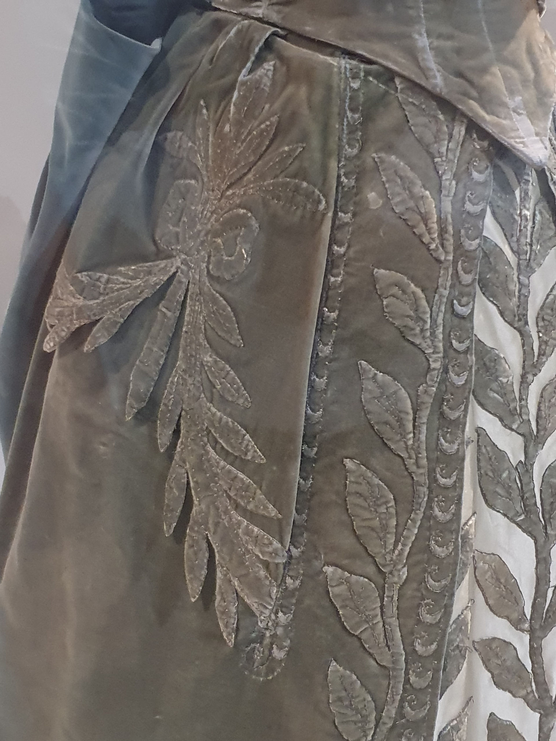 Skir tdetails of an appliqued evening gown