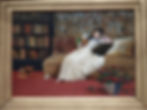 Painting of a woman on a sofa reading a book