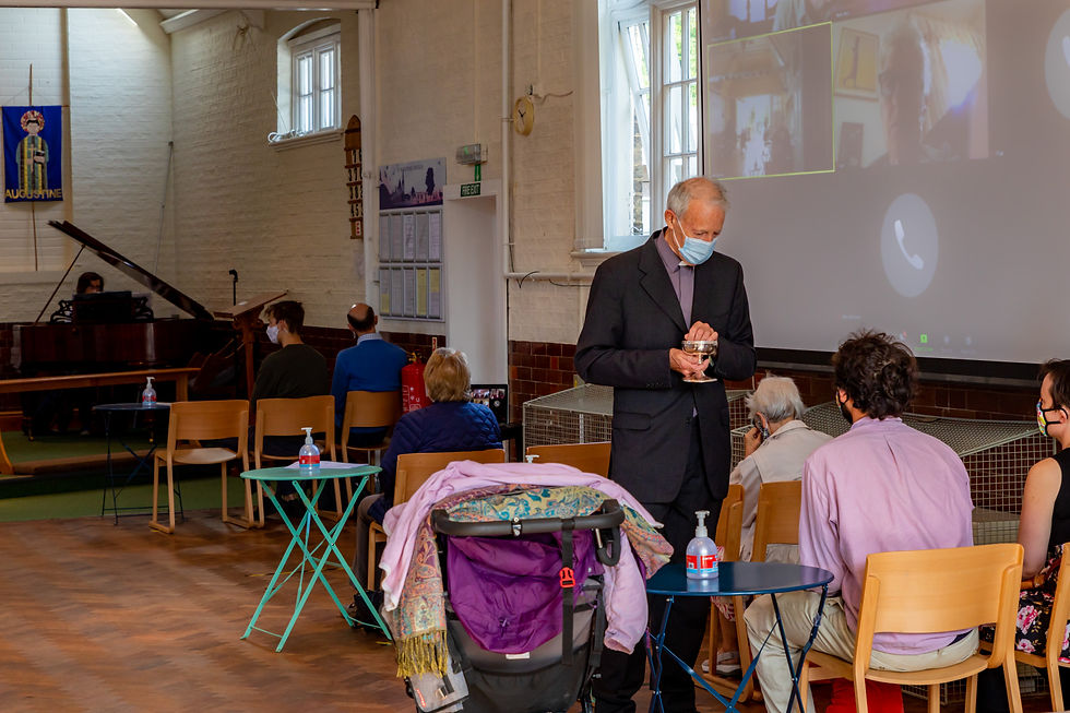 Pandemic photo. Technology in action with those more vunerable and isolating attending using Zoom. St Augustine's Church, Cambridge.