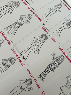 Live illustration artist creating personalised guest portraits at an Umberto Giannini curly hair and haircare brand event.