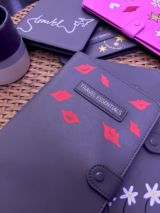 Personalised passport holders featuring hand-painted live illustrations created at an event.