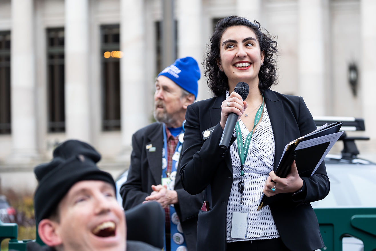 Image of Darya speaking at a rally for people with developmental disabilities