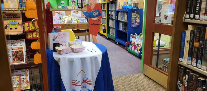Dolly Day and DPIL Program all rolled into one, this is the entrance to the kids room with a blue tableclothed covered registration area.