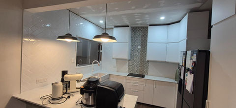 Kitchen herringbone pattern splashback tile installation Newmarket Brisbane — premium herringbone subway tile splashback modern kitchen inner north Brisbane residential property