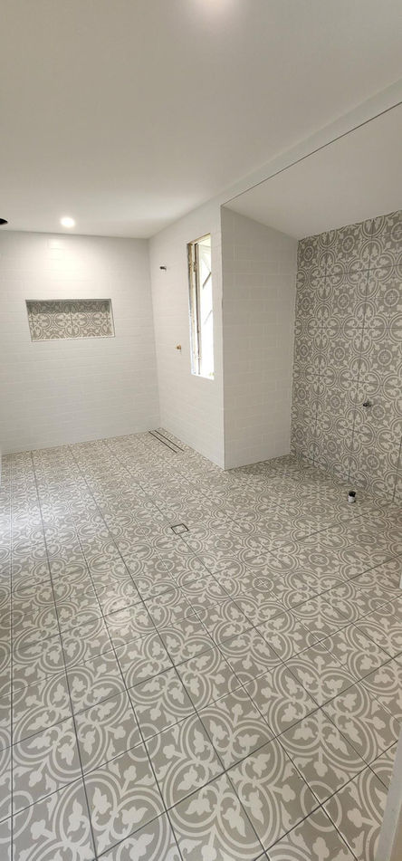Decorative pattern floor tile installation Strathpine Brisbane — custom pattern porcelain tiles residential property north Brisbane Moreton Bay region