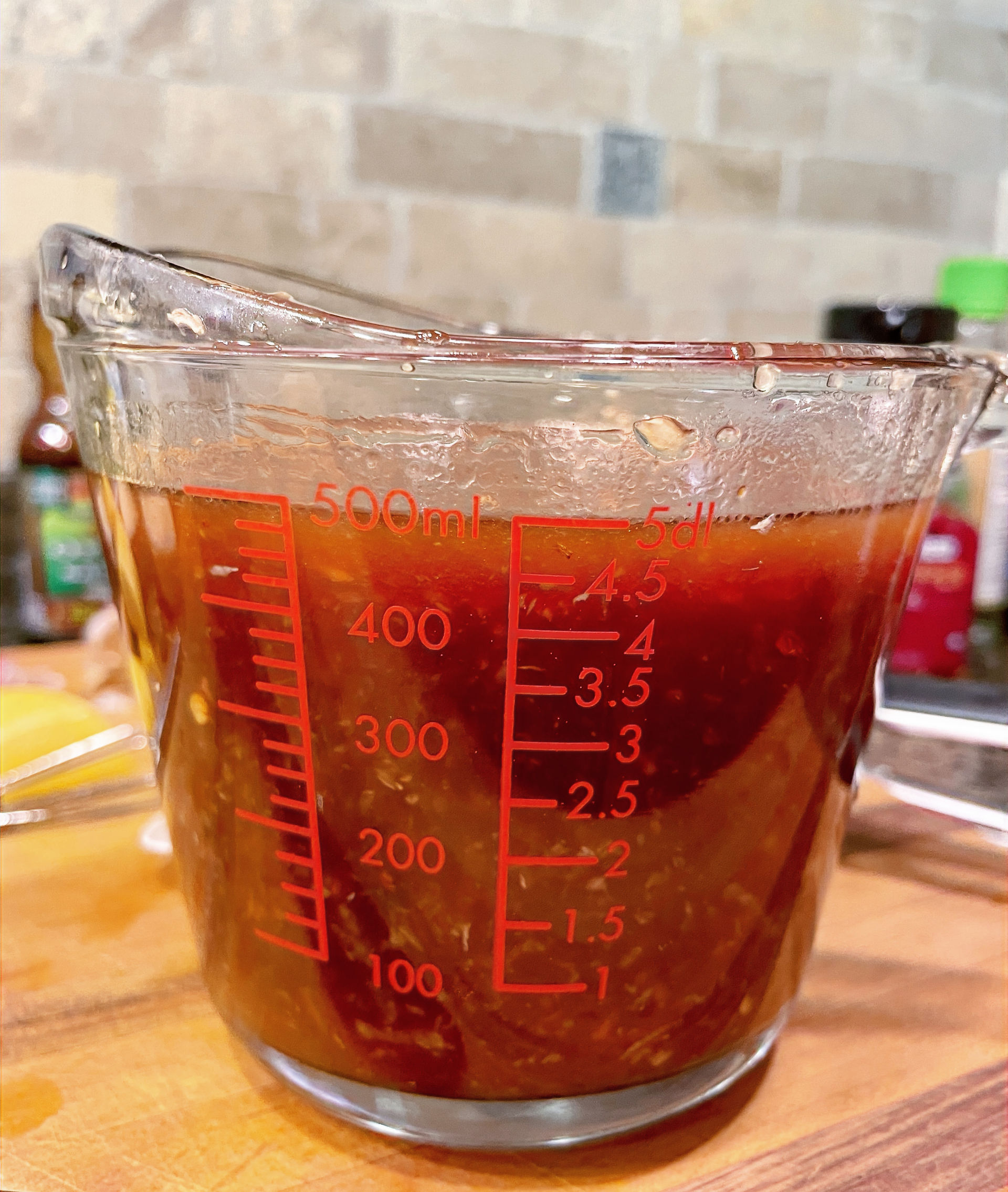 2-cup measuring cup with homemade sweet and spicy sauce