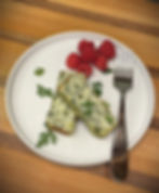 place with egg souffle and raspberries